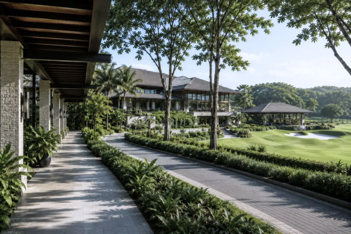 Covered pedestrian walkway and landscaped circulation route connecting clubhouse facilities within a tropical golf resort